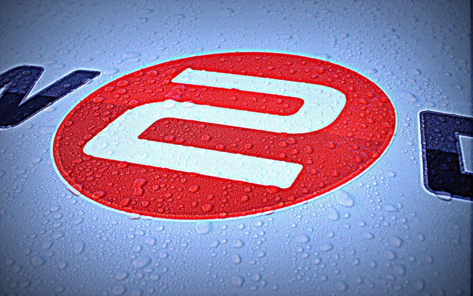 The How-2-Drive logo as depicted on the bonnet of Howard's tuition vehicle.