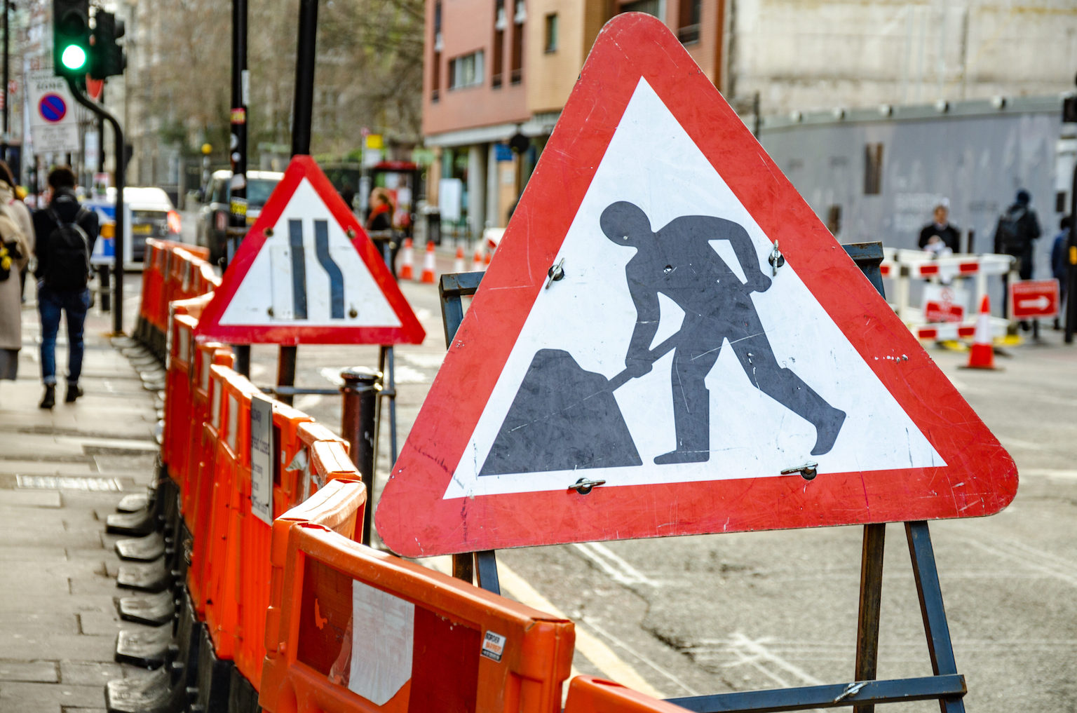 Traffic signs indicating roadworks, which represents the concept of hazard perception.